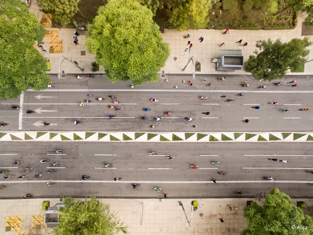 People cycling and walking along an open street in Mexico City free of car traffic.